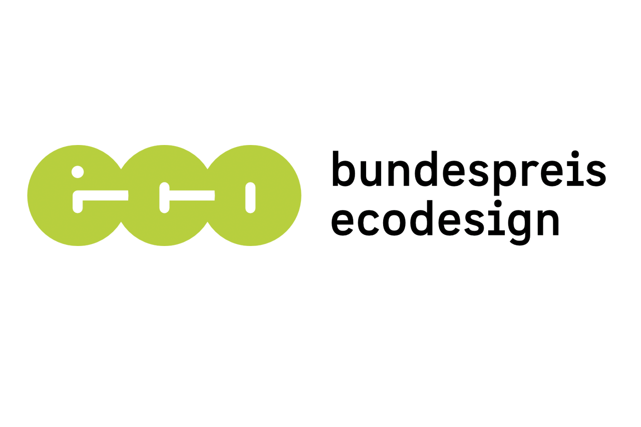 Abgebildet ist das Logo des Bundespreis Ecodesign. Der Preis wird vom Bundesumweltministerium und Umweltbundesamt in Kooperation mit dem Internationalen Design Zentrum Berlin ausgelobt